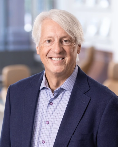 portrait of a smiling person in professional attire